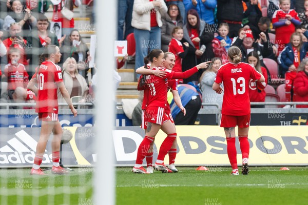 070326 - Wales v Montenegro - 2027 FIFA Women's World Cup Qualifying - Hannah Cain of Wales celebrates with team mates after scoring a goal