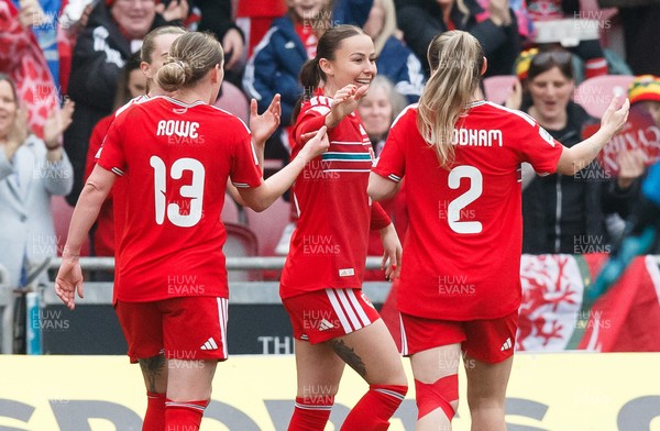 070326 - Wales v Montenegro - 2027 FIFA Women's World Cup Qualifying - Hannah Cain of Wales celebrates with team mates after scoring a goal