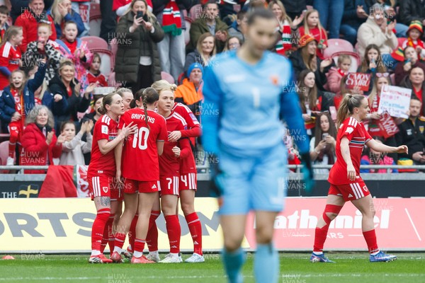 070326 - Wales v Montenegro - 2027 FIFA Women's World Cup Qualifying - Hannah Cain of Wales celebrates with team mates after scoring a goal