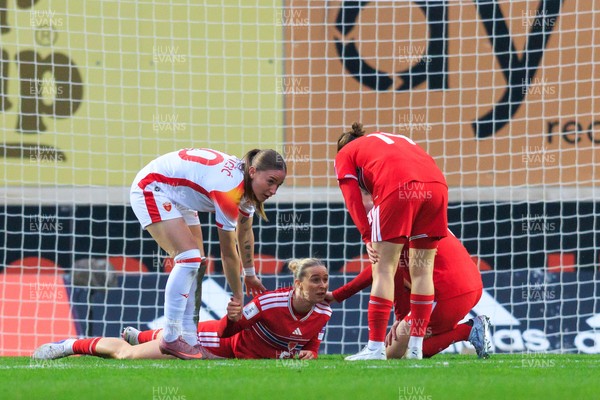 070326 - Wales v Montenegro - 2027 FIFA Women's World Cup Qualifying - Rhiannon Roberts of Wales receives medical attention