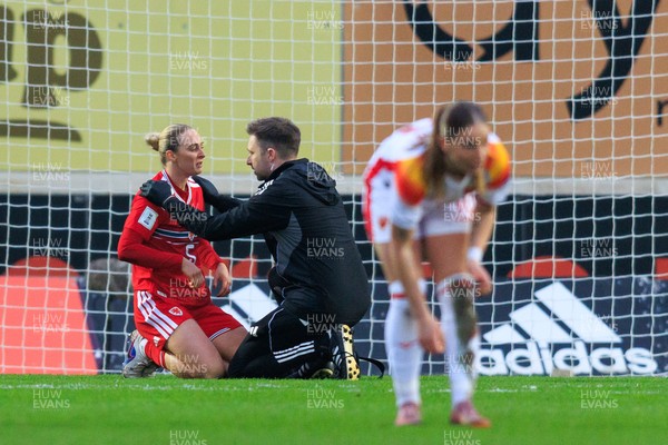 070326 - Wales v Montenegro - 2027 FIFA Women's World Cup Qualifying - Rhiannon Roberts of Wales receives medical attention