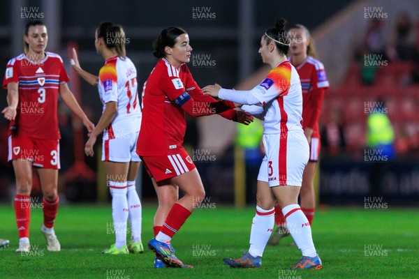 070326 - Wales v Montenegro - 2027 FIFA Women's World Cup Qualifying - Players shake hands at the end of the match