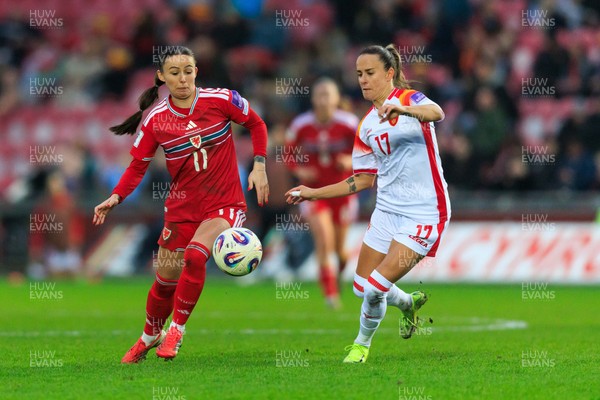 070326 - Wales v Montenegro - 2027 FIFA Women's World Cup Qualifying - Hannah Cain of Wales is challenged by Darija Dukic of Montenegro