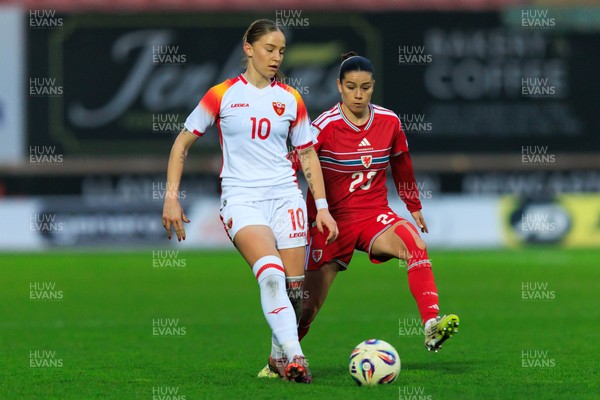 070326 - Wales v Montenegro - 2027 FIFA Women's World Cup Qualifying - Ffion Morgan of Wales and Jelena Karlicic of Montenegro