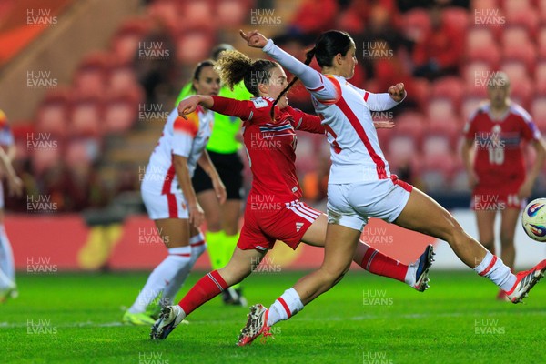 070326 - Wales v Montenegro - 2027 FIFA Women's World Cup Qualifying - Lois Joel of Wales and Jelena Petrovic of Montenegro