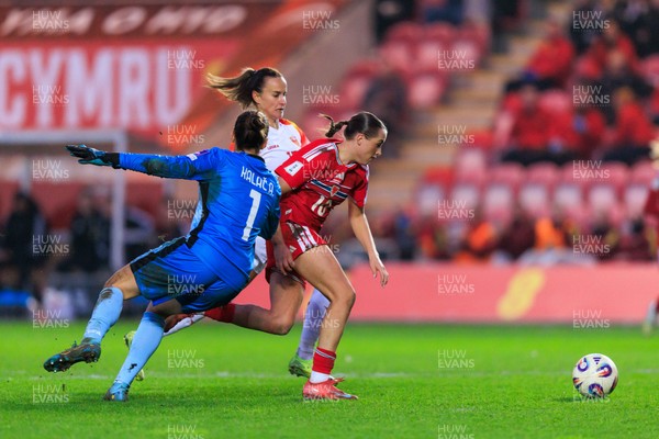 070326 - Wales v Montenegro - 2027 FIFA Women's World Cup Qualifying - Mared Griffiths of Wales goes past Ajsa Kalac of Montenegro on the way to scoring a goal