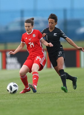 040619 - Wales v New Zealand, Women's International Challenge Match - Hayley Ladd of Wales holds off Sarah Gregorius of New Zealand