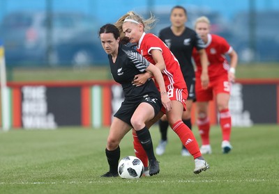 040619 - Wales v New Zealand, Women's International Challenge Match - Olivia Chance of New Zealand holds off Charlie Estcourt of Wales