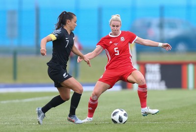 040619 - Wales v New Zealand, Women's International Challenge Match - Ali Riley of New Zealand is challenged by Rhiannon Roberts of Wales