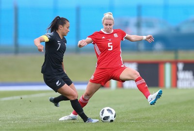 040619 - Wales v New Zealand, Women's International Challenge Match - Ali Riley of New Zealand is challenged by Rhiannon Roberts of Wales