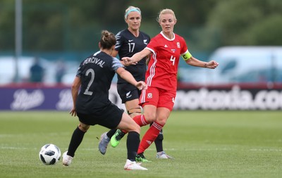 040619 - Wales v New Zealand, Women's International Challenge Match - Sophie Ingle of Wales plays the ball past Ria Percival of New Zealand