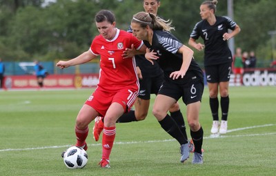 040619 - Wales v New Zealand, Women's International Challenge Match - Helen Ward of Wales holds off Rebekah Stott of New Zealand