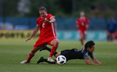 040619 - Wales v New Zealand, Women's International Challenge Match - Loren Dykes of Wales brings down Sarah Gregorius of New Zealand