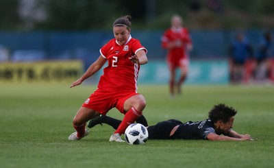040619 - Wales v New Zealand, Women's International Challenge Match - Loren Dykes of Wales brings down Sarah Gregorius of New Zealand