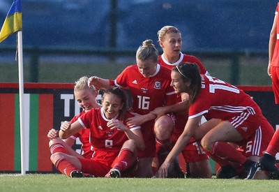 040619 - Wales v New Zealand, Women's International Challenge Match - Wales players celebrate after their late goal wins the match 1- 0