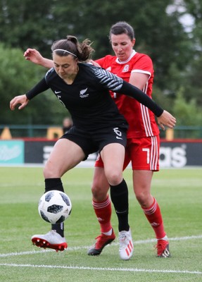 040619 - Wales v New Zealand, Women's International Challenge Match - Meikayla Moore of New Zealand is challenged by Helen Ward of Wales