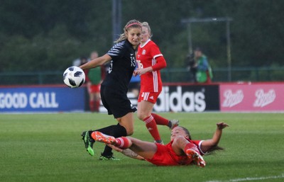 040619 - Wales v New Zealand, Women's International Challenge Match - Rosie White of New Zealand fires a shot at goal as Natasha Harding of Wales closes in to challenge