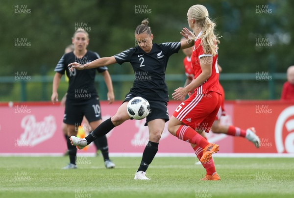 040619 - Wales v New Zealand, Women's International Challenge Match - Ria Percival of New Zealand holds off Elise Hughes of Wales
