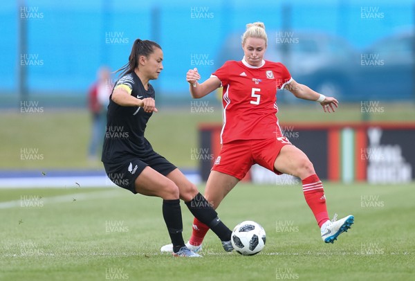 040619 - Wales v New Zealand, Women's International Challenge Match - Ali Riley of New Zealand is challenged by Rhiannon Roberts of Wales
