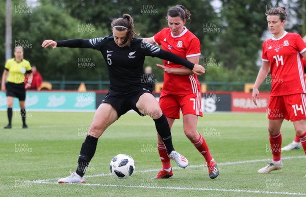 040619 - Wales v New Zealand, Women's International Challenge Match - Meikayla Moore of New Zealand is challenged by Helen Ward of Wales