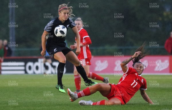 040619 - Wales v New Zealand, Women's International Challenge Match - Rosie White of New Zealand fires a shot at goal as Natasha Harding of Wales closes in to challenge