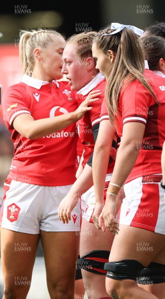 281023 - Wales Women v New Zealand Women, WXV1 - Abbie Fleming of Wales, centre, is congratulated after she powers over to score try