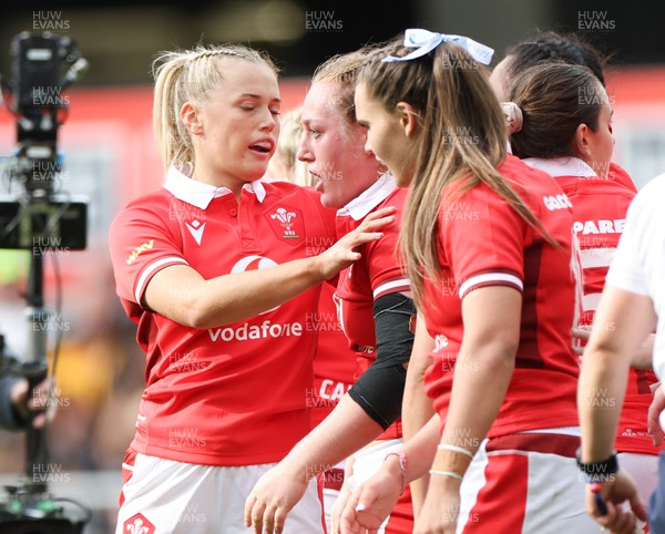 281023 - Wales Women v New Zealand Women, WXV1 - Abbie Fleming of Wales, centre, is congratulated after she powers over to score try