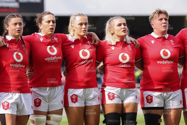 281023 - Wales Women v New Zealand Women, WXV1 -  Left to right, Robyn Wilkins, Sioned Harries, Meg Webb, Alex Callender and Donna Rose line up for the anthems at the start of the match