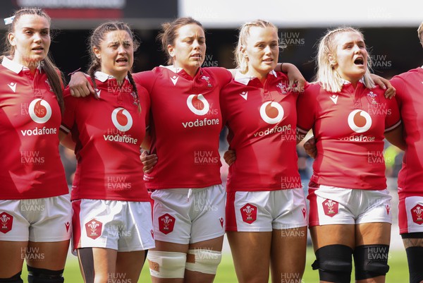281023 - Wales Women v New Zealand Women, WXV1 -  Left to right, Bryonie King, Robyn Wilkins, Sioned Harries, Meg Webb and Alex Callender line up for the anthems at the start of the match