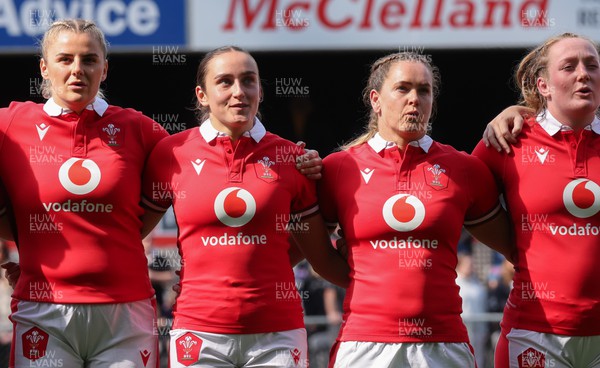 281023 - Wales Women v New Zealand Women, WXV1 -  Left to right, Carys Williams-Morris, Nel Metcalfe, Kat Evans and Abbie Fleming line up for the anthems at the start of the match