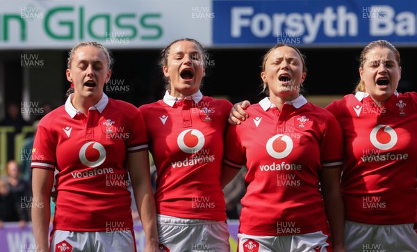 281023 - Wales Women v New Zealand Women, WXV1 -  Left to right, Hannah Jones, Jasmine Joyce, Alisha Butchers and Bethan Lewis line up for the anthems at the start of the match