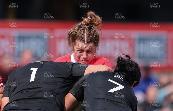 281023 - Wales Women v New Zealand Women, WXV1 - Kate Williams of Wales is stopped by Kate Henwood of New Zealand and Kennedy Simon of New Zealand