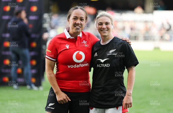 281023 - Wales Women v New Zealand Women, WXV1 - Arihiana Marino-Tauhinu of New Zealand and Keira Bevan of Wales swap match shirts at the end of the match