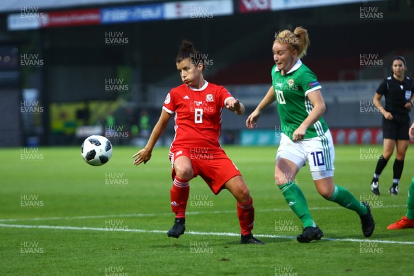 030919 - Wales v Northern Ireland - European Women's Championship - Group Stage -  Angharad James of Wales holds the ball up under pressure from Rachel Furness of Northern Ireland 