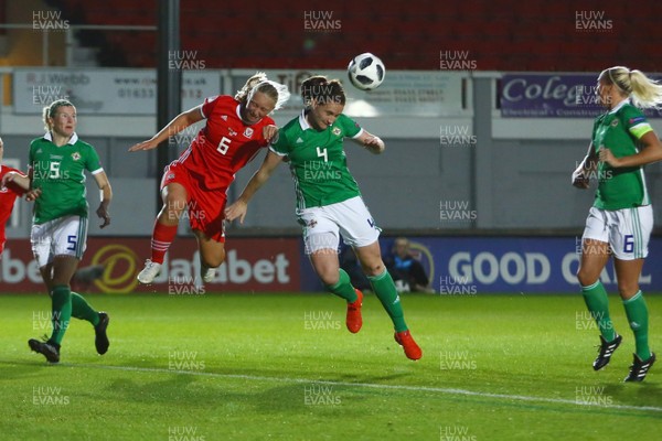 030919 - Wales v Northern Ireland - European Women's Championship - Group Stage -  Elise Hughes of Wales and Sarah McFadden of Northern Ireland complete for a cross in the penalty area 