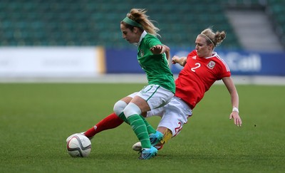 190816 - Wales Women v Republic of Ireland, Friendly Challenge - Julie-Ann Russell of Ireland is tackled by Rhiannon Roberts of Wales