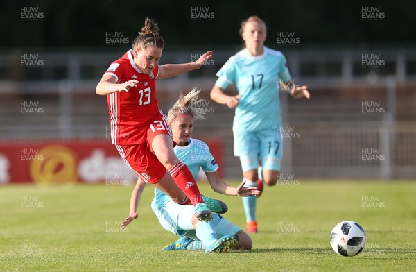 120618 - Wales Women v Russia Women - FIFA Women's World Cup Qualifying Round - Rachel Rowe of Wales is tackled by Anastasiya Akimova of Russia