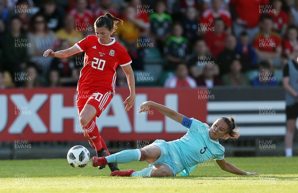 120618 - Wales Women v Russia Women - FIFA Women's World Cup Qualifying Round - Helen Ward of Wales is challenged by Anna Kozhnikova of Russia