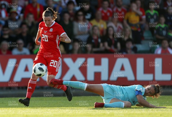 120618 - Wales Women v Russia Women - FIFA Women's World Cup Qualifying Round - Helen Ward of Wales is challenged by Anna Kozhnikova of Russia