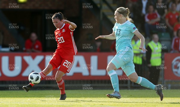 120618 - Wales Women v Russia Women - FIFA Women's World Cup Qualifying Round - Helen Ward of Wales is challenged by Anna Belomyttseva of Russia