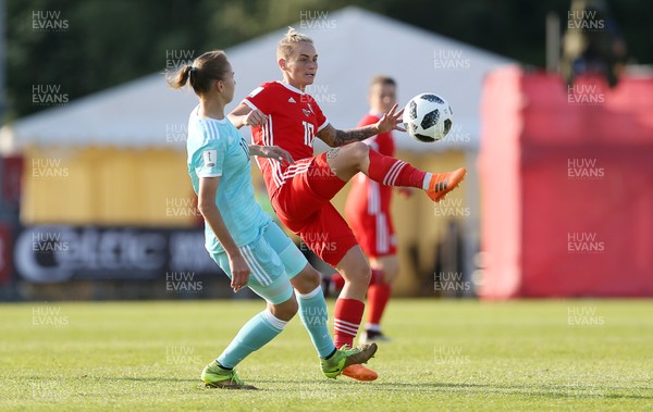 120618 - Wales Women v Russia Women - FIFA Women's World Cup Qualifying Round - Jess Fishlock of Wales is challenged by Nadezhda Smirnova of Russia