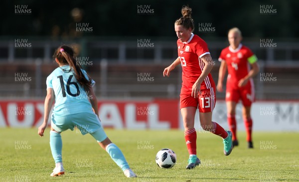 120618 - Wales Women v Russia Women - FIFA Women's World Cup Qualifying Round - Rachel Rowe of Wales takes on Lipa Yakupova of Russia