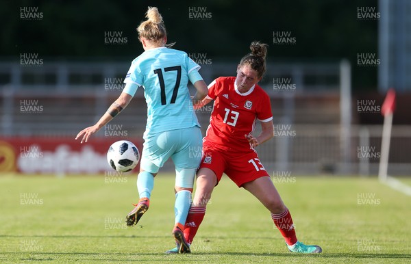 120618 - Wales Women v Russia Women - FIFA Women's World Cup Qualifying Round - Ekaterina Pantyukhina of Russia is tackled by Rachel Rowe of Wales