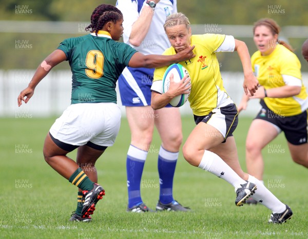 Huw Evans Agency 2010 - Wales' Laura Prosser breaks past Saloma Booysen - Wales v South Africa  - Women's  Rugby World Cup - (9th Place Play-Off)Surrey Sports Park - 05/09/2010 - All rights reserved