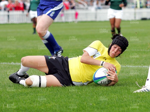 Huw Evans Agency 2010 - Wales' Ceri Redman  dives on a kick through to score a try Wales v South Africa  - Women's  Rugby World Cup - (9th Place Play-Off)Surrey Sports Park - 05/09/2010 - All rights reserved