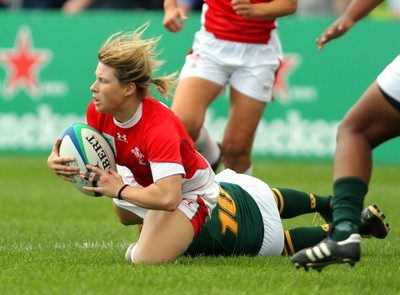 Huw Evans Agency 2010 -  Wales' Mared Evans tackled by  SA's Zenay Jordaan  Wales v South Africa  - Women's  Rugby World Cup - Surrey Sports Park - 24/08/2010 - All rights reserved