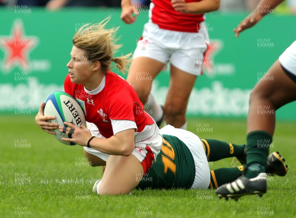 Huw Evans Agency 2010 -  Wales' Mared Evans tackled by  SA's Zenay Jordaan  Wales v South Africa  - Women's  Rugby World Cup - Surrey Sports Park - 24/08/2010 - All rights reserved