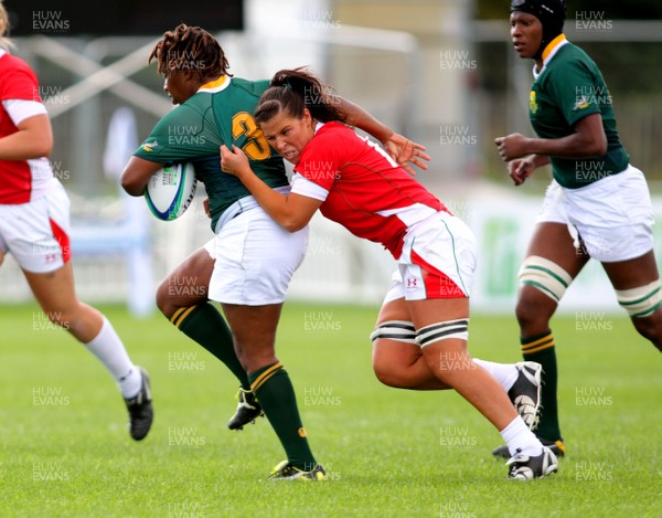  Huw Evans Agency 2010 - Wales' Shona Powell-Hughes tries to tackle Cebisa Kula - Wales v South Africa  - Women's  Rugby World Cup - Surrey Sports Park - 24/08/2010 - All rights reserved