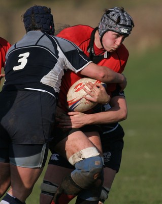 02.02.08 The Women's 6 Nations. Walesvs. Scotland. Taffs Well RFC, Cardiff, Wales. 
 
Louise Horgan's charge is halted by Beth Dickson(3) & Lyndsey Wheeler. 
 
