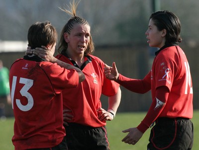 02.02.08 The Women's 6 Nations. Wales vs. Scotland. Taffs Well RFC, Cardiff, Wales. 
 
(L-R)) Rachel Poolman(13) Clare Flowers & Naomi Thomas discuss tactics during a break in play. 
 
